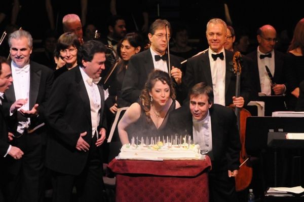 Michael Capasso, Irina Rindzuner and Victor DeRenzi blow out the candles on the cake Photo